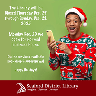 Cheerful man with santa hat and phone with ugly sweater for Christmas on.